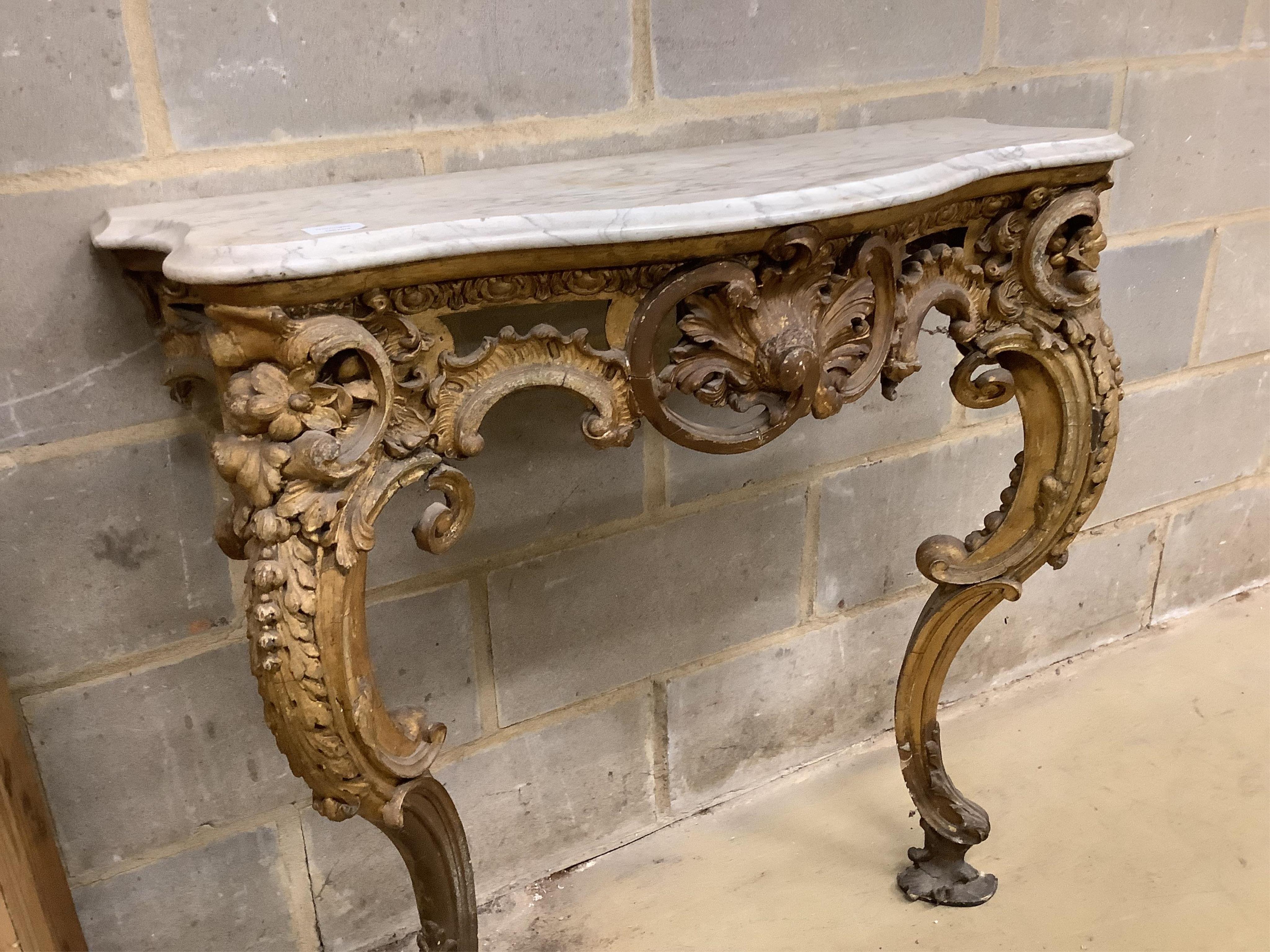 A Victorian giltwood and composition marble top serpentine console table, width 93cm, depth 37cm, height 90cm. Condition - fair